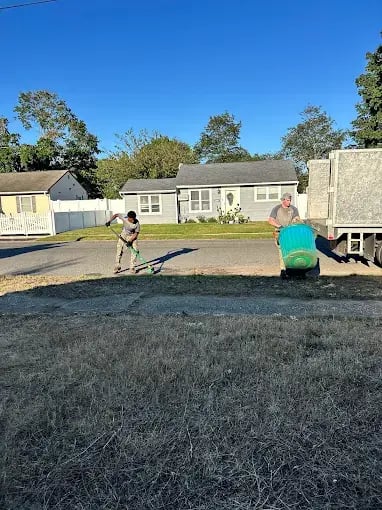 Jiffy Junk crew performing yard debris removal and cleanup in Kansas City